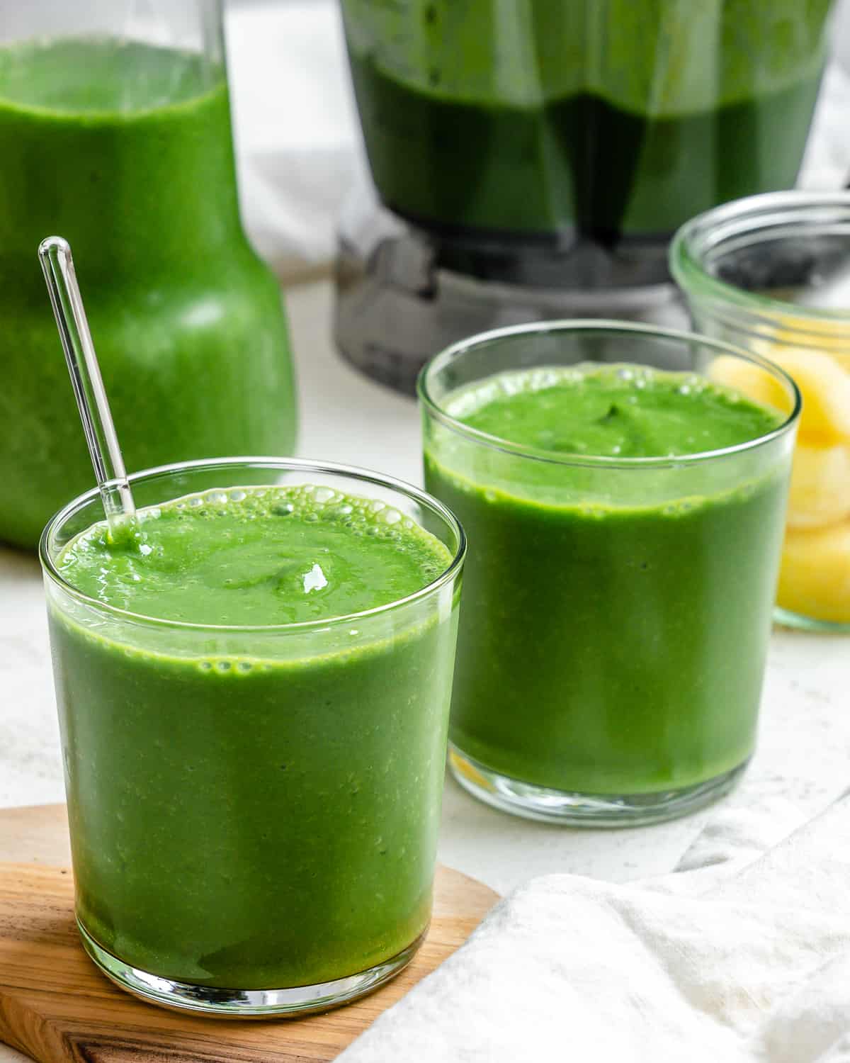 two glasses of finished kale and pineapple smoothie 