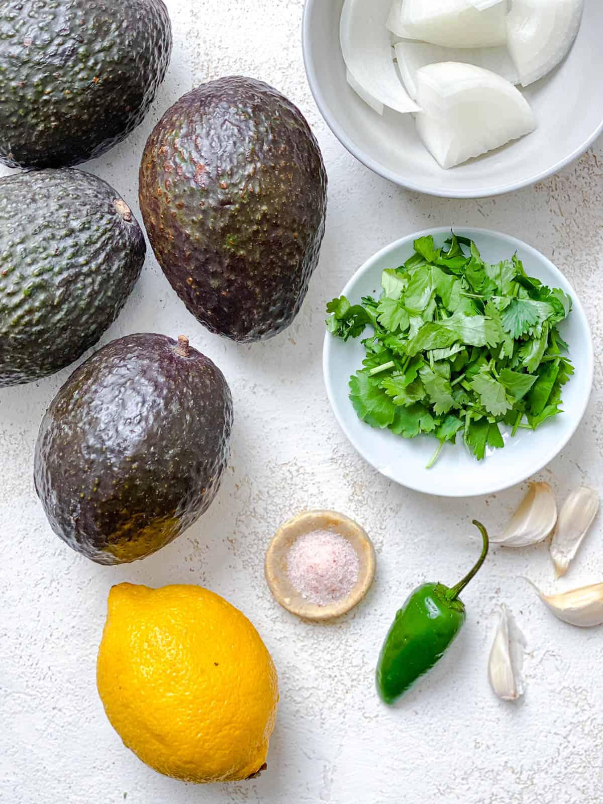 ingredients for Mexican Avocado Crema measured out against a white background