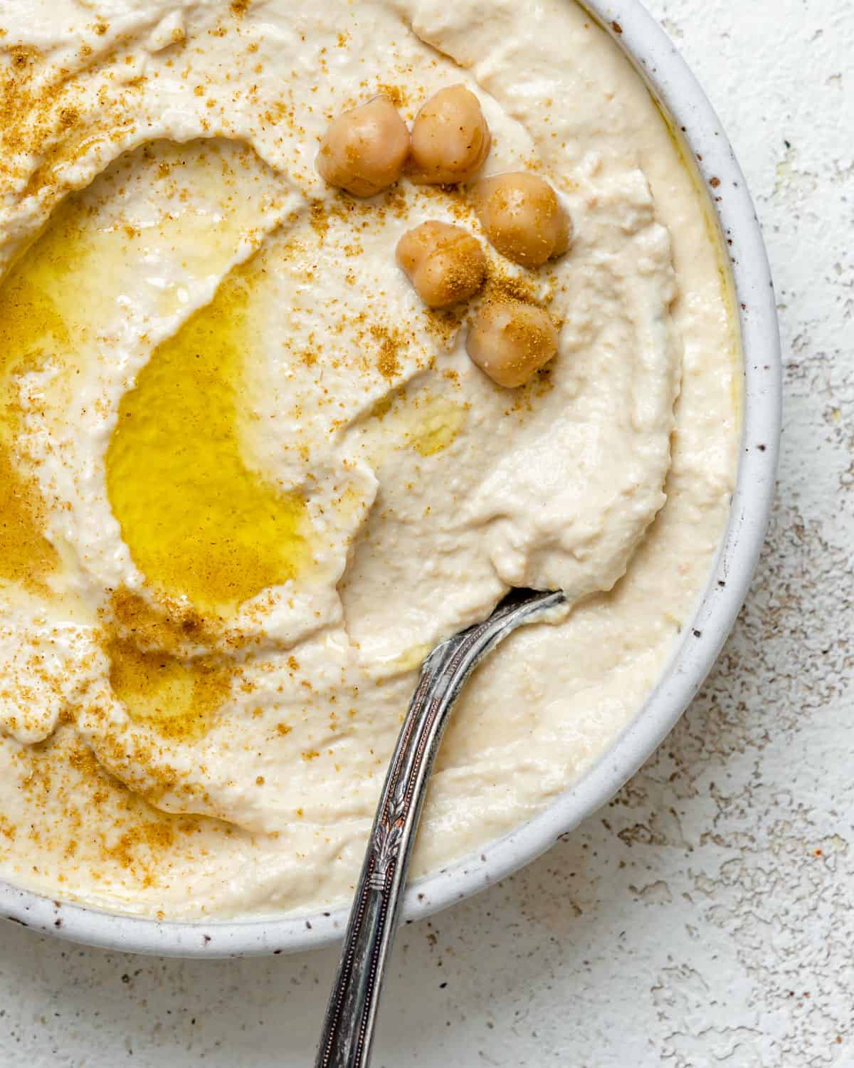 completed Easy Hummus in a bowl against a light background