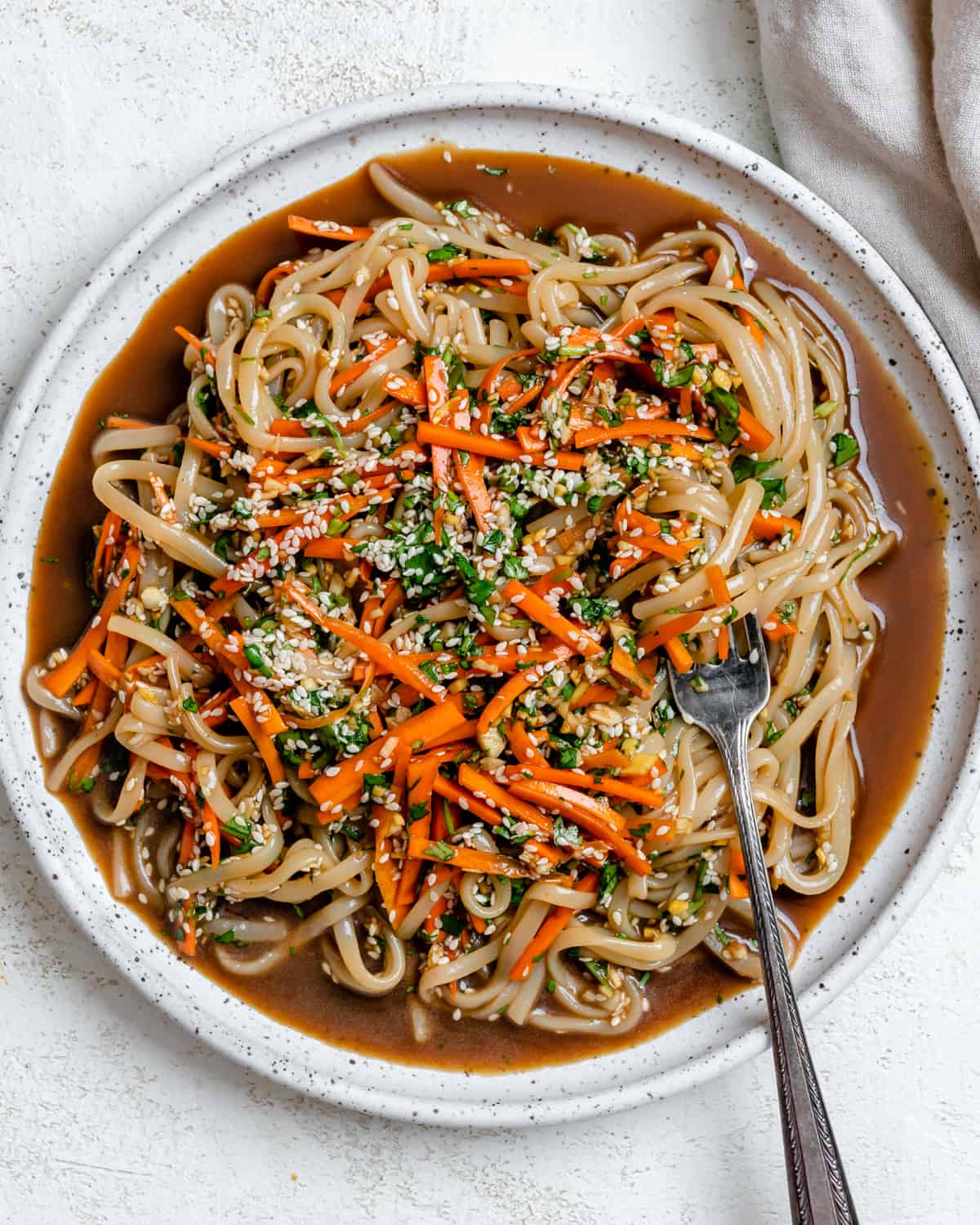 completed Asian Noodle Salad plated against a white background