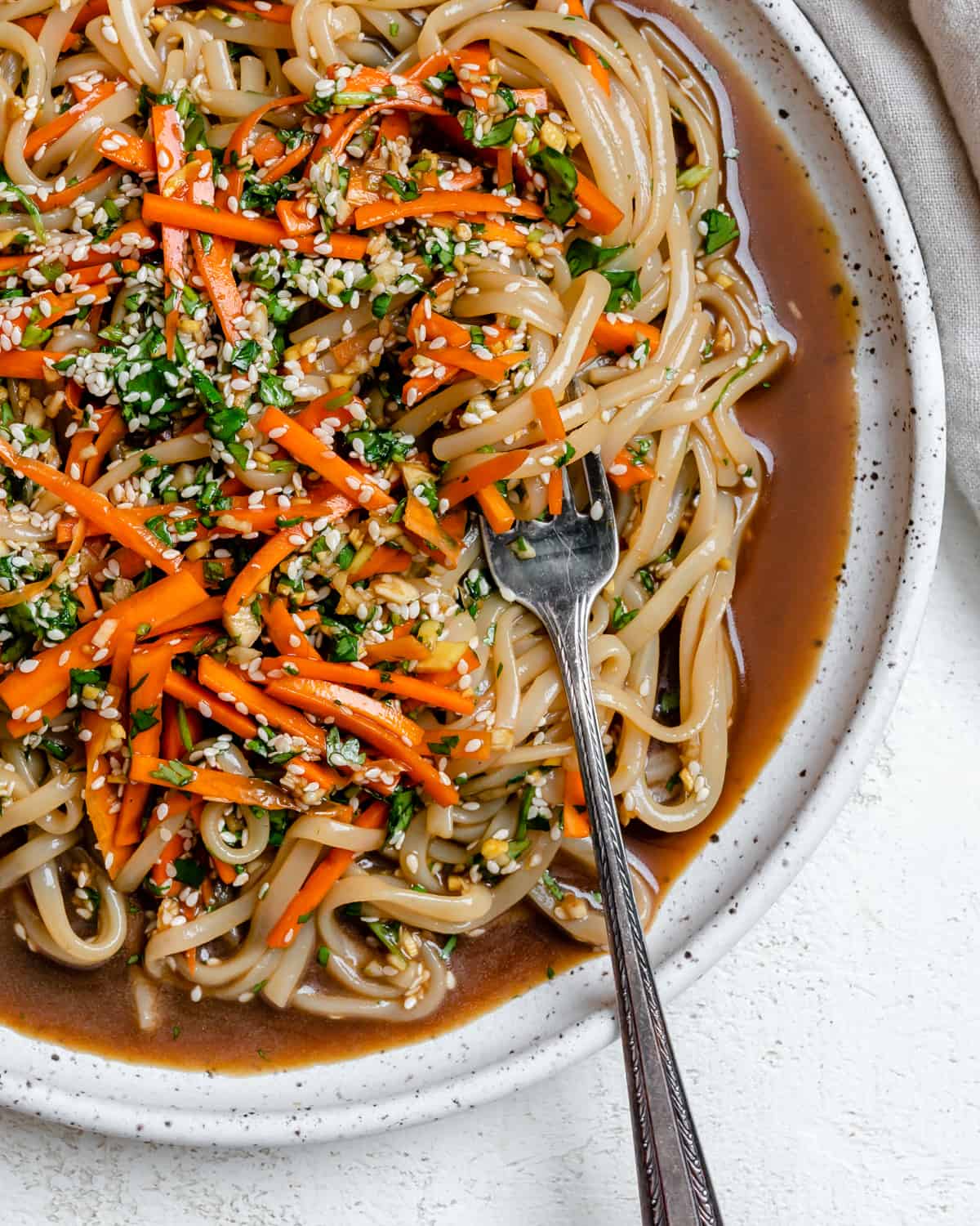 completed Asian Noodle Salad plated against a white background