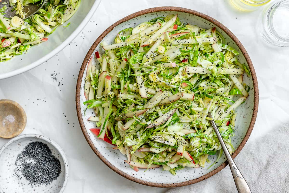 completed Shaved Brussel Sprout Slaw with Apples in a bowl