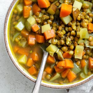 completed Lentil and Carrot Soup in a bowl against a light surface