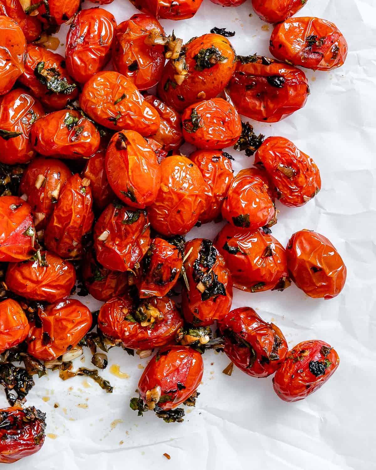completed Easy Roasted Cherry Tomatoes against a white surface