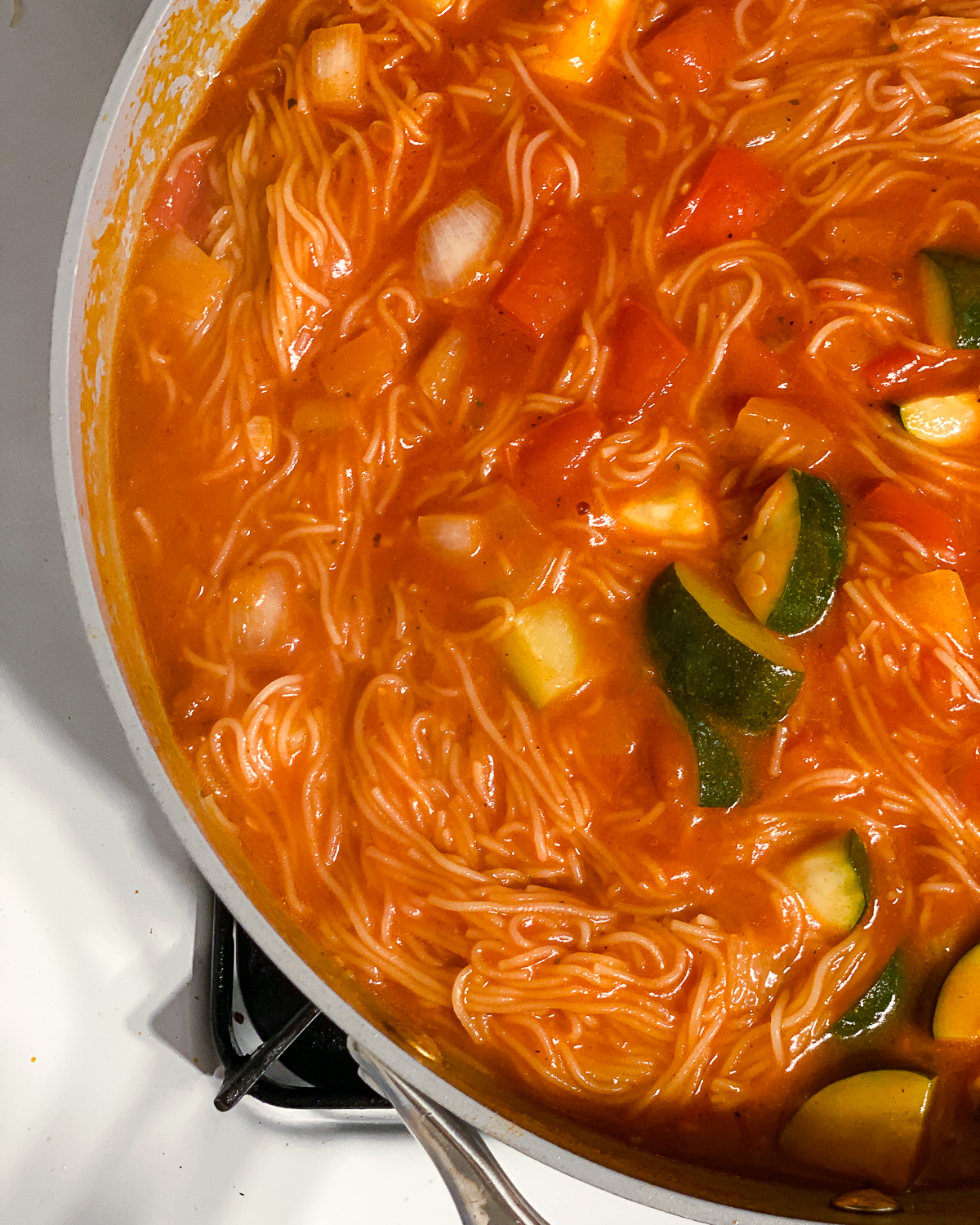 process shot of 20-Minute Sopa de Fideo (Mexican Noodle Soup) cooking in a pan