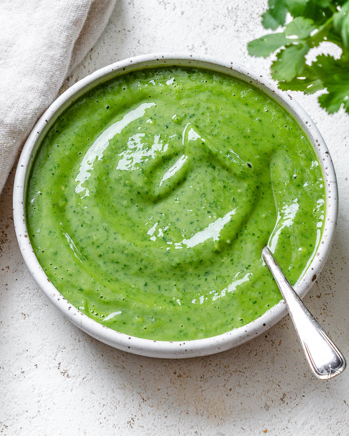 completed Avocado Green Goddess Dressing in a bowl against a light surface