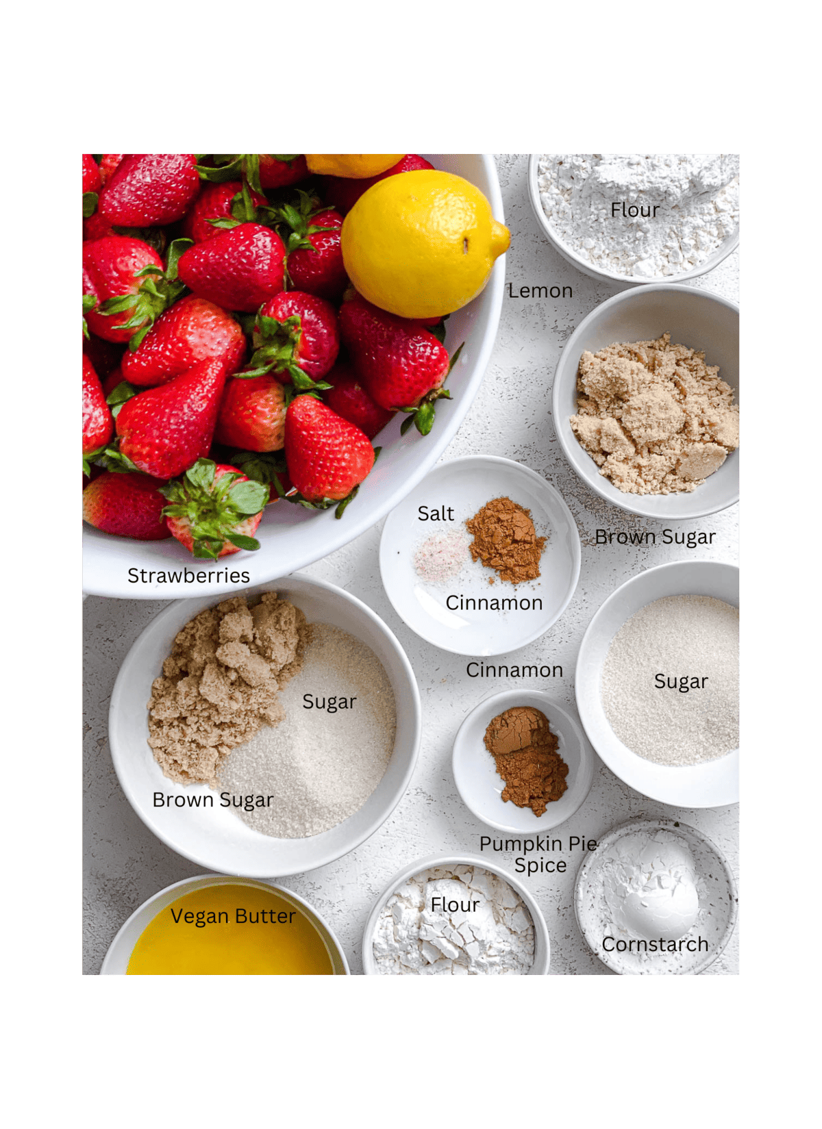 ingredients for Easy Strawberry Crumble measured out against a light surface