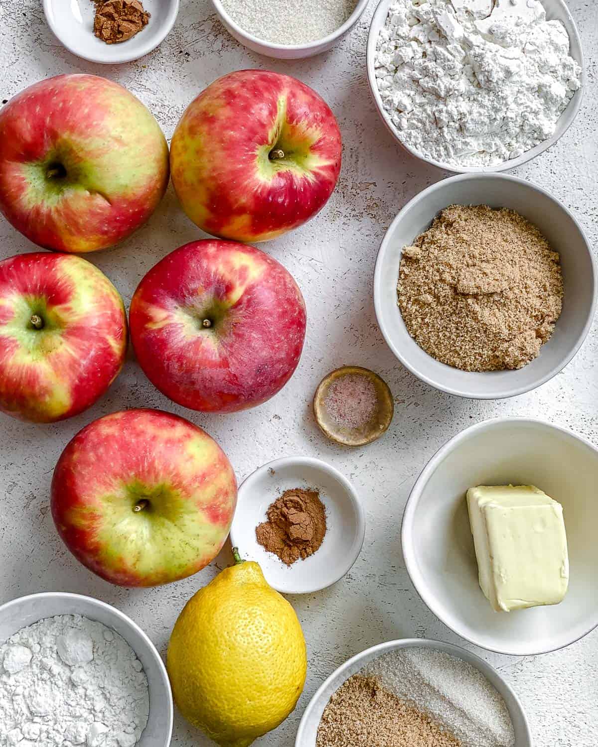 ingredients for The Best Vegan Apple Crumble measured out against a white surface
