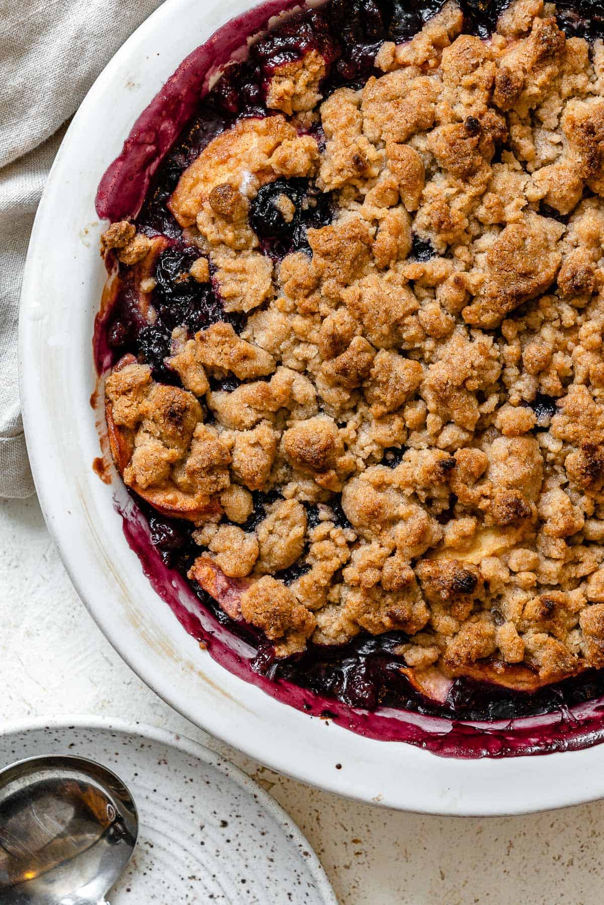 completed Apple and Blueberry Crumble against a light background