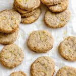 completed Vegan Lemon Shortbread Cookies scattered on a white surface