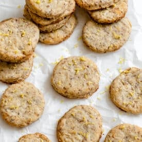completed Vegan Lemon Shortbread Cookies scattered on a white surface