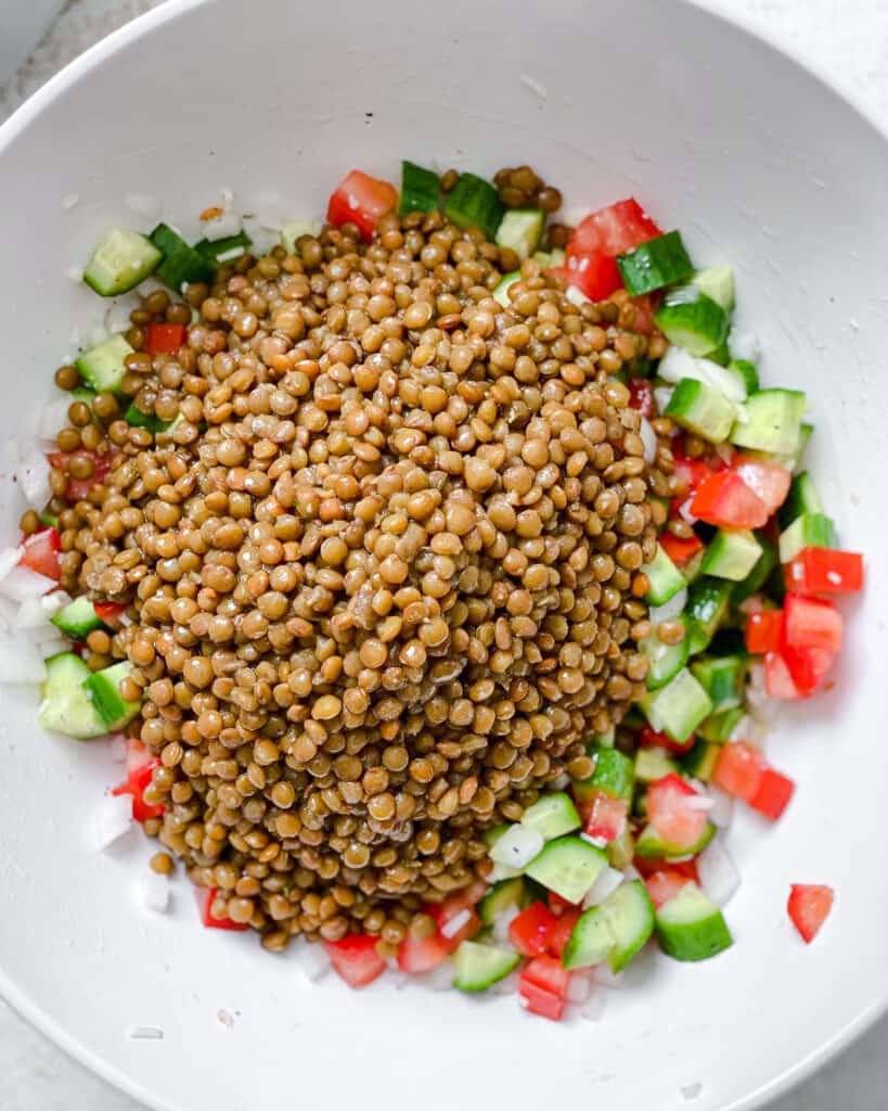 process shot post adding lentils to bowl of veggies