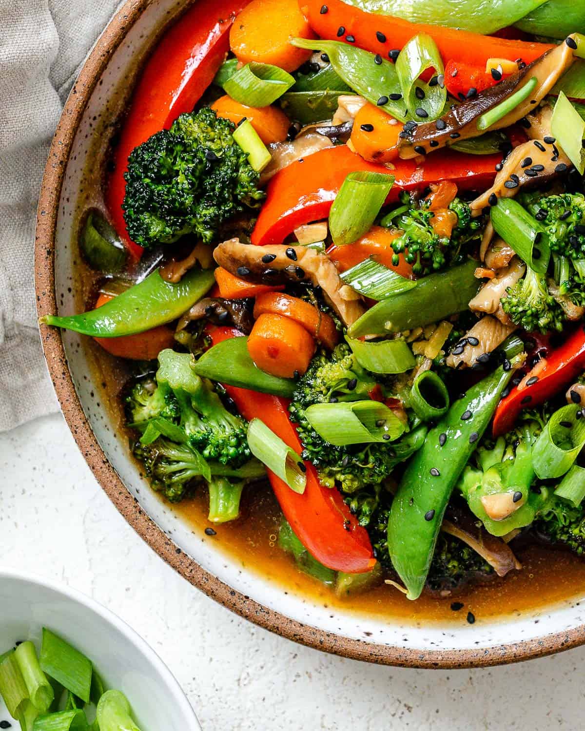 completed Easy Stir-Fry Vegetables in a bowl a،nst a light background