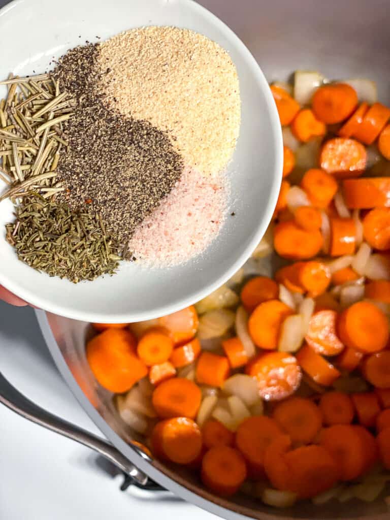 process shot of adding seasoning to pan