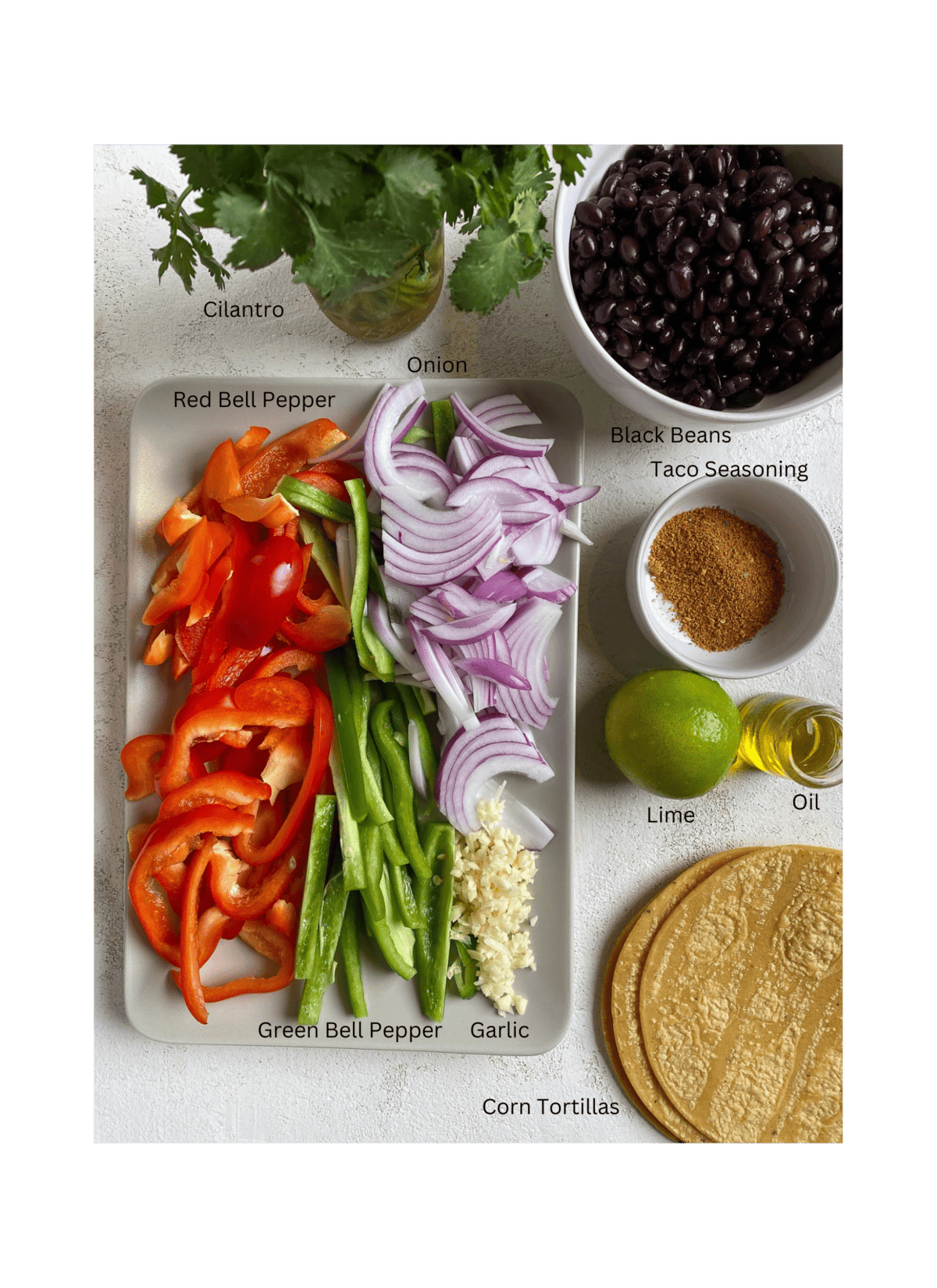 ingredients for Vegan Fajita Tacos a،nst a white surface