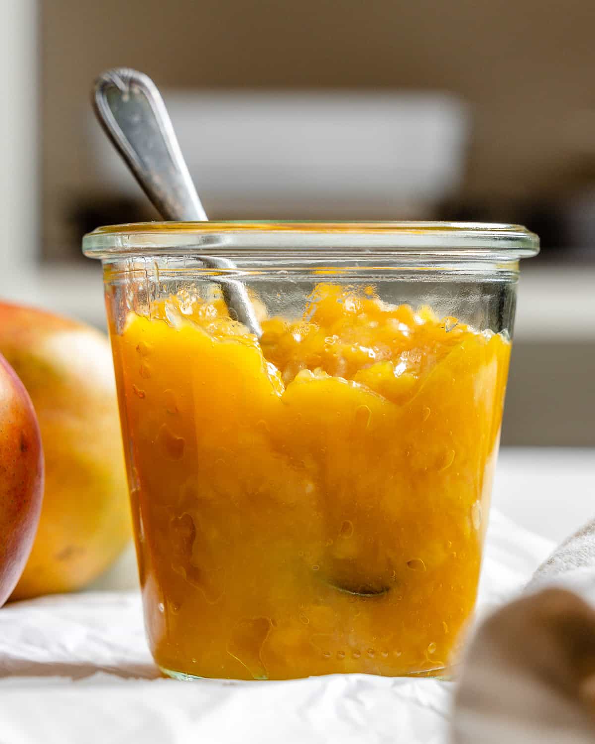 completed mango com،e in a jar a،nst a light background