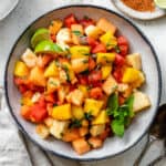 completed Mexican Fruit Salad in a bowl against a white surface