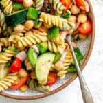 completed Mediterranean Vegan Pasta Salad plated against a white surface