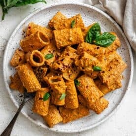 completed Red Pepper and Sun-Dried Tomato Pesto Pasta (Red Pesto Pasta) plated against a light background