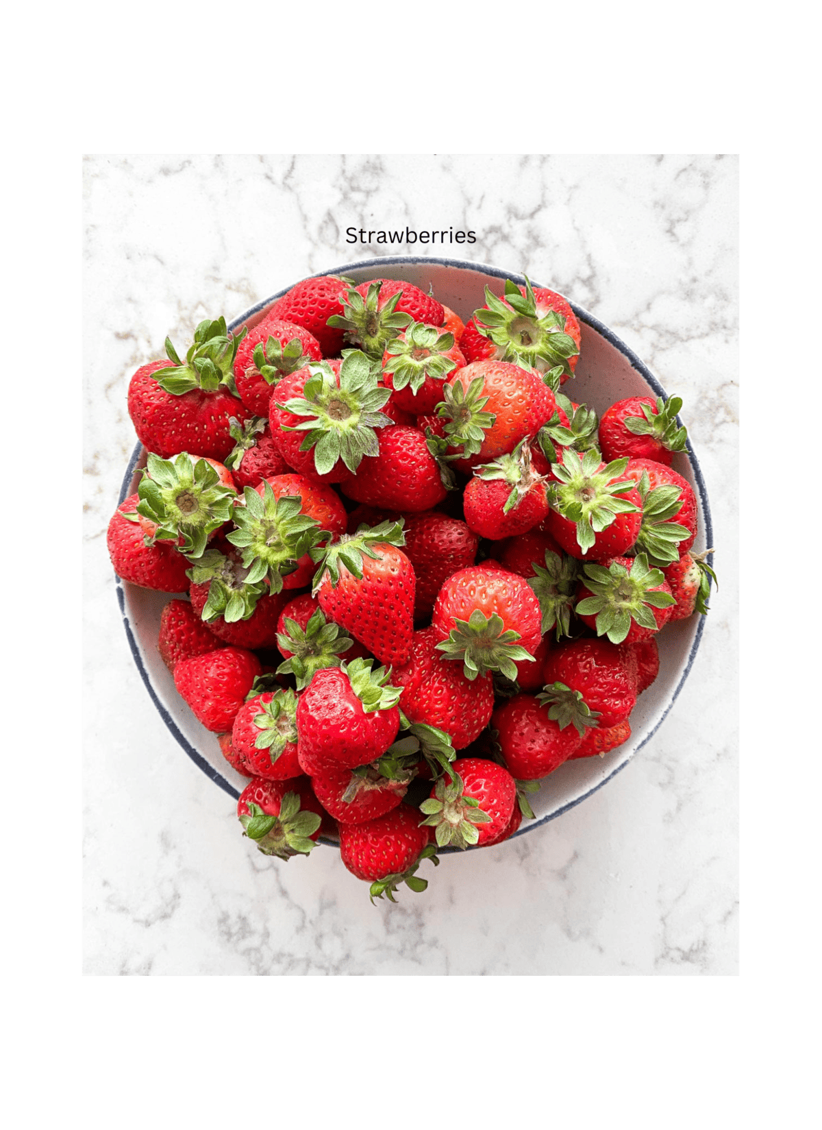 bowl of strawberries against a white background