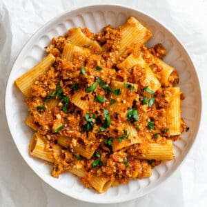 completed Tofu Bolognese palted on a white plate