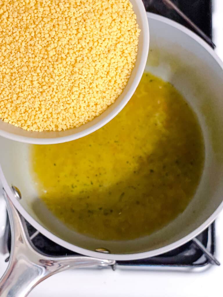 process shot of adding couscous to pot