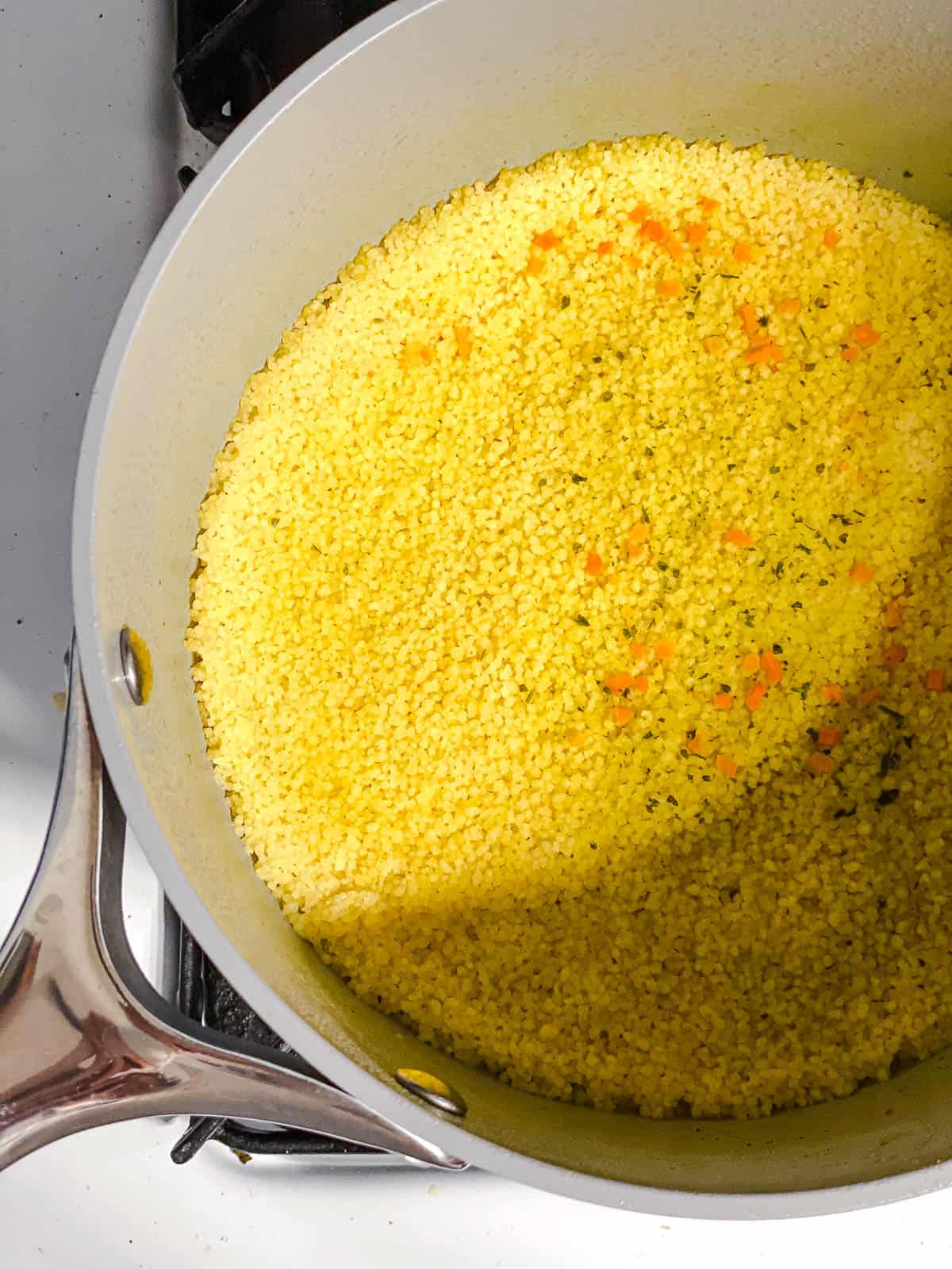 process shot of couscous cooking in pot