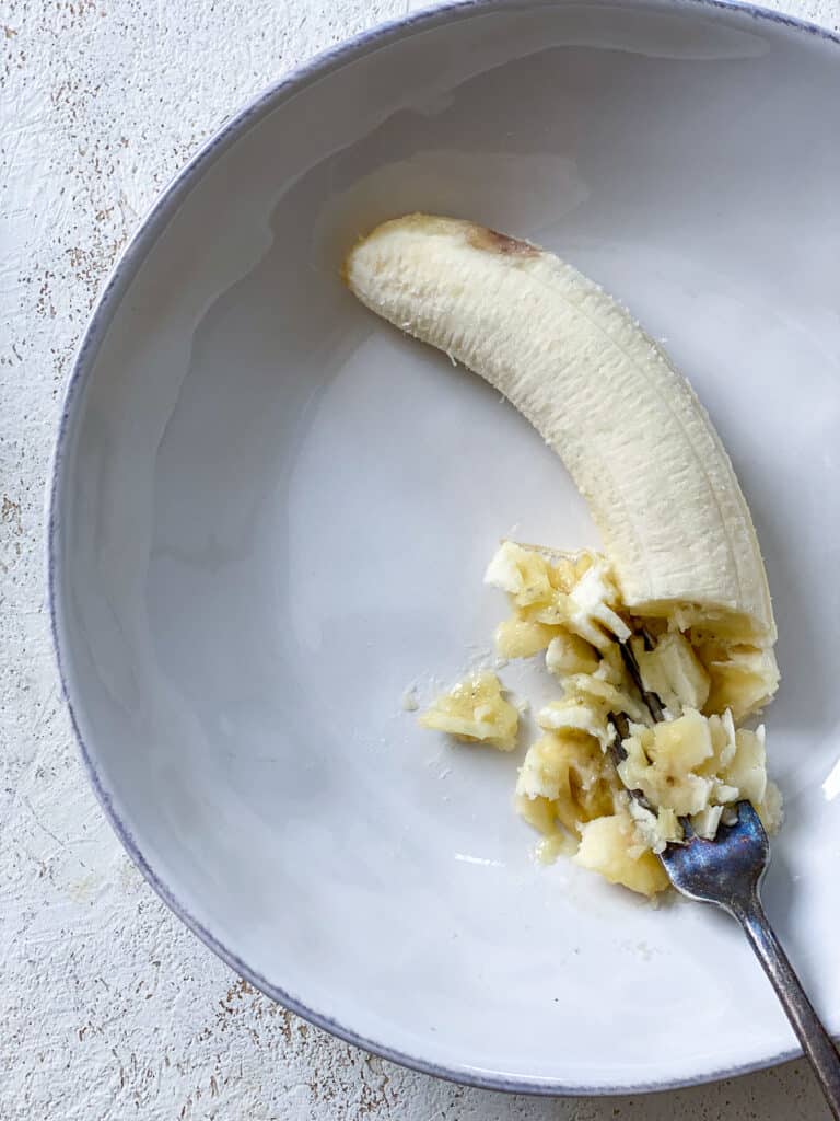 process shot of mashing banana on a plate