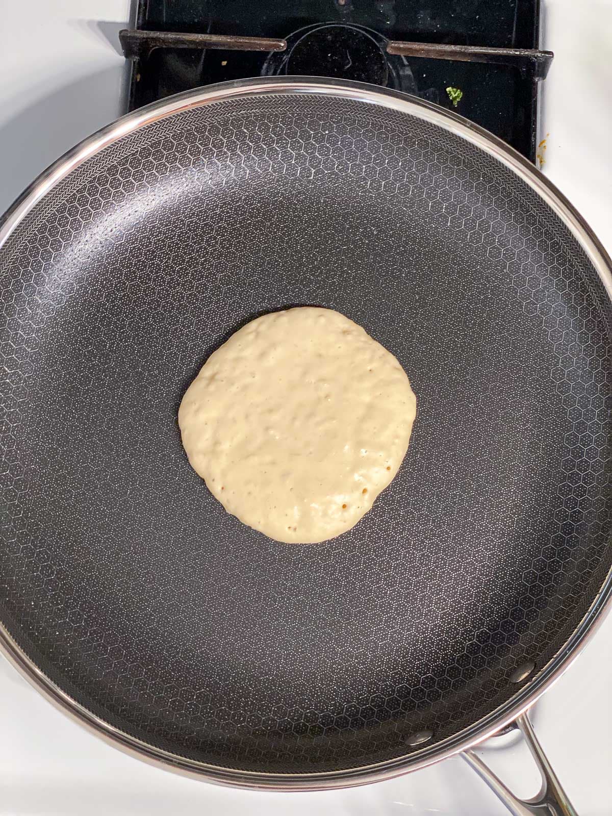 process shot of adding batter to skillet