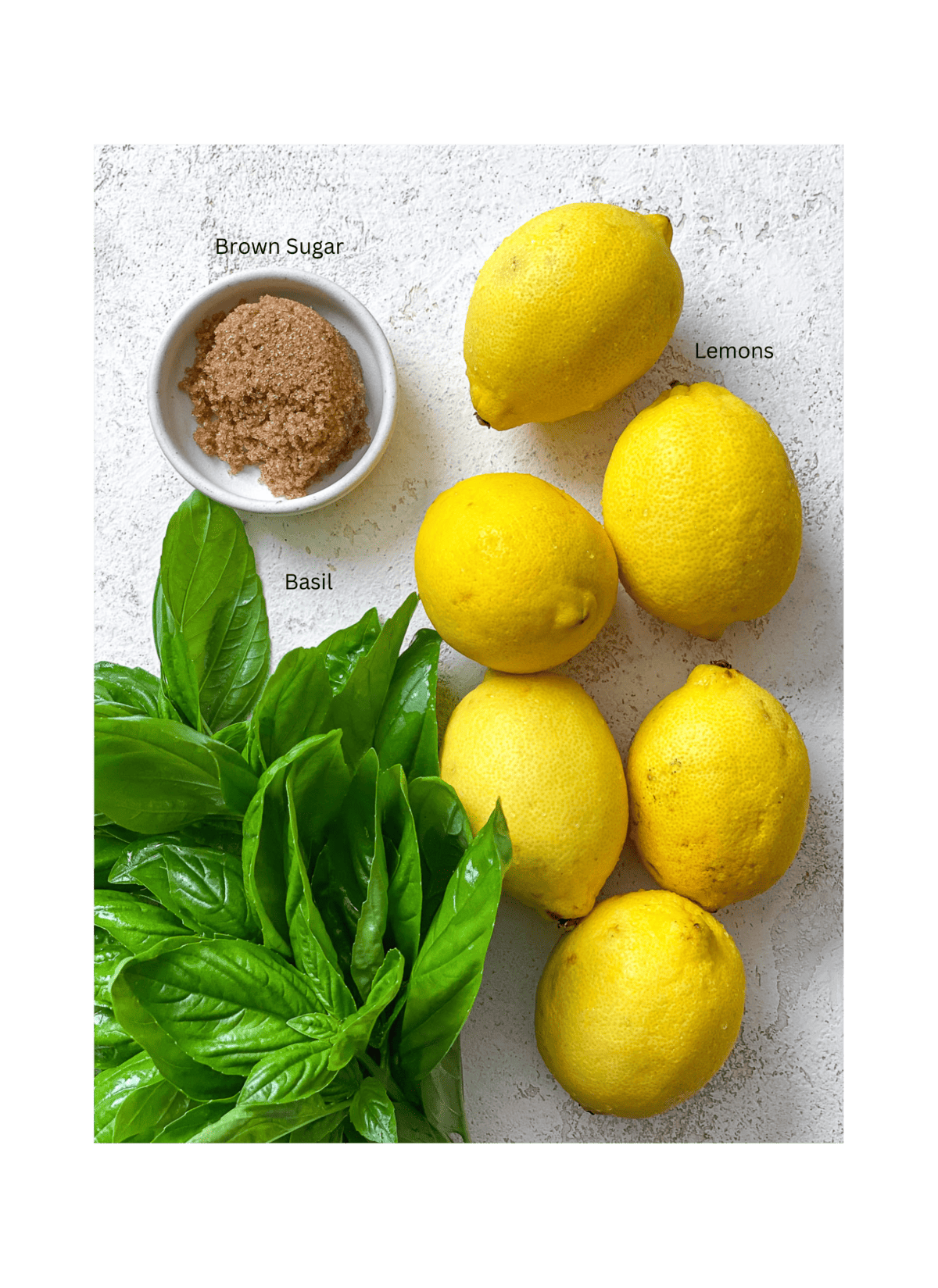 ingredients for Basil Lemonade [+ Flavor Variations] measured out against a white surface