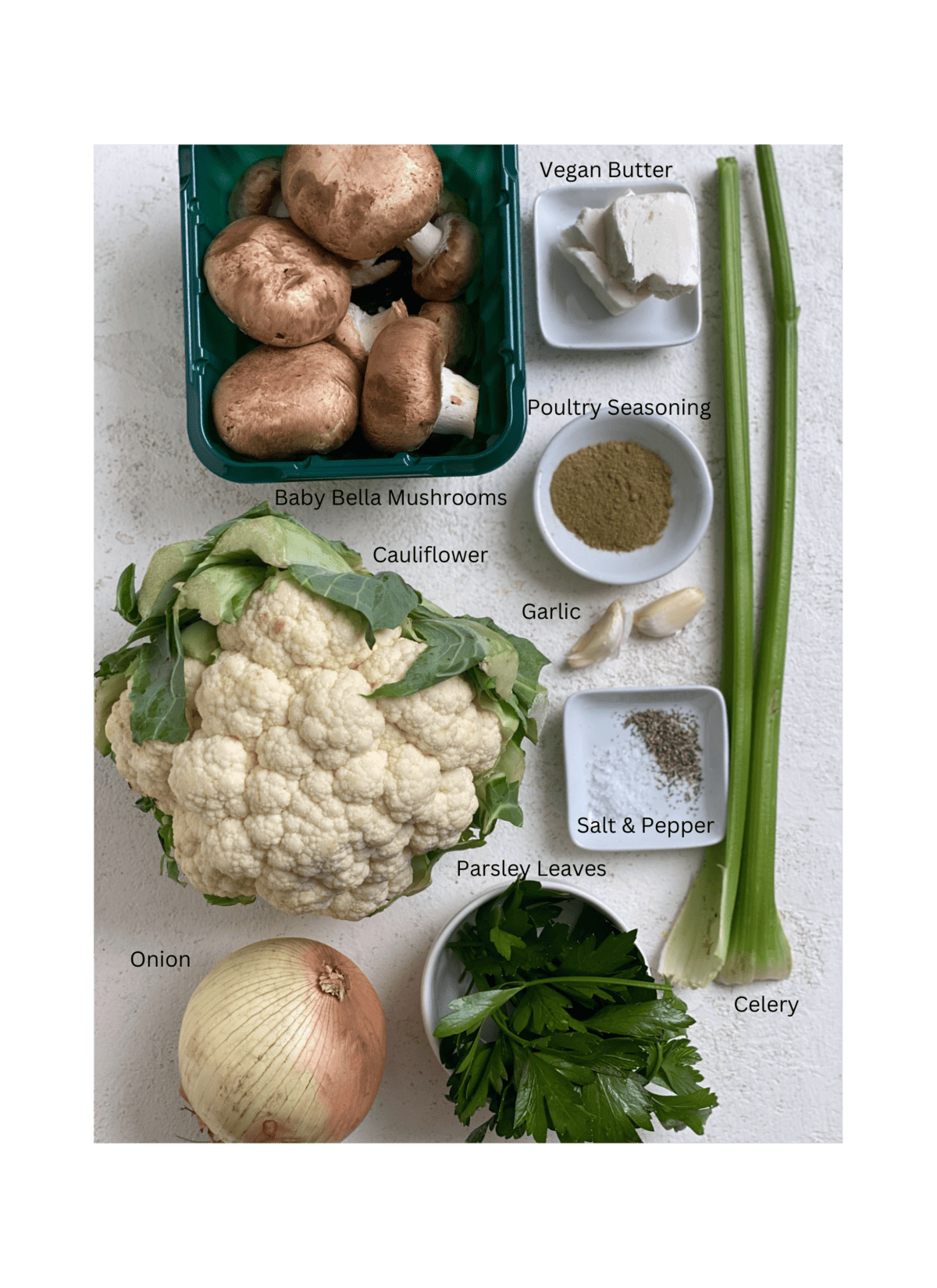 ingredients for The Best Cauliflower Stuffing measured out against a white surface