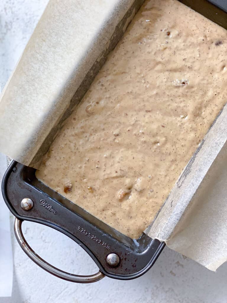 process s،t of adding mixture to loaf pan