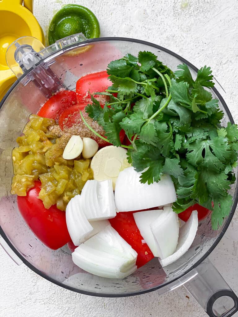 process shot of ingredients being added to a blender