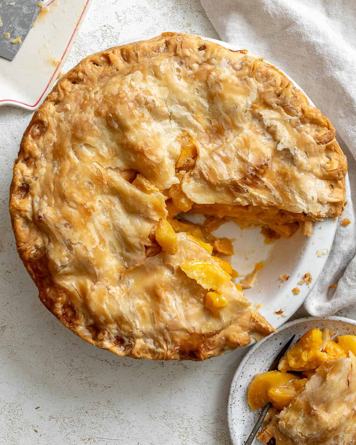 completed Easy Peach Mango Pie [or Hand pies] against a white surface