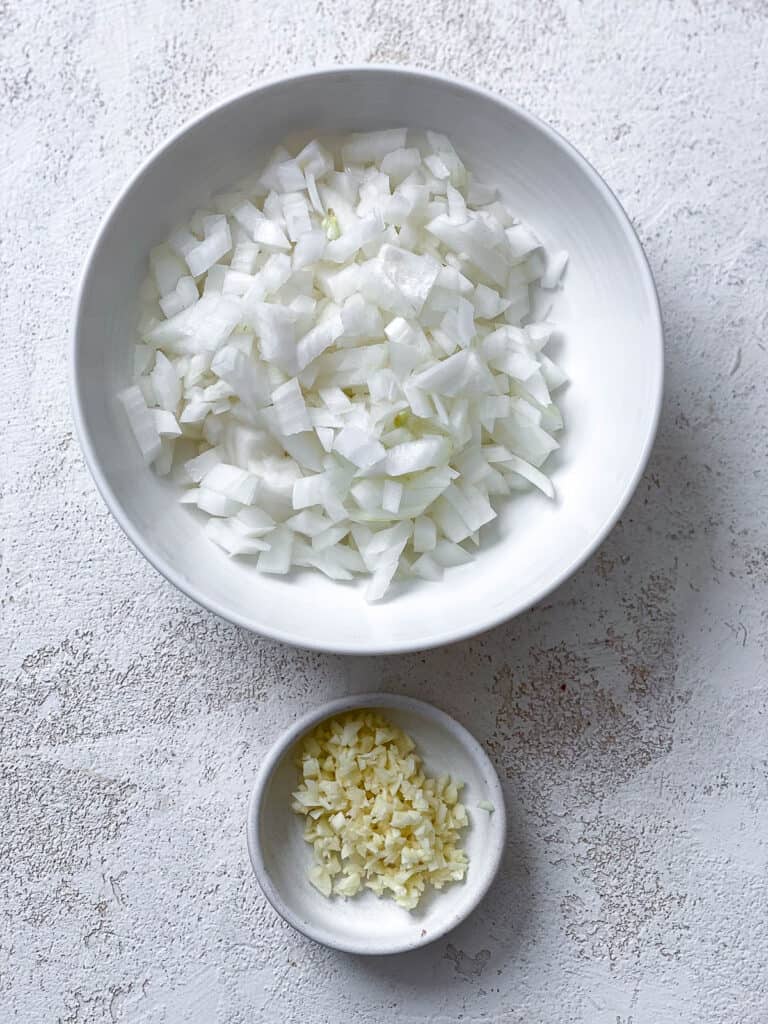 ingredients for Easy Vegan Mexican Rice measured against a white surface