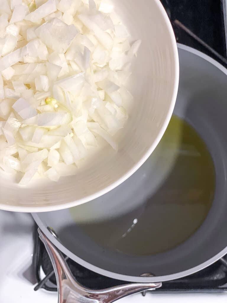 process shot of adding onion to pot