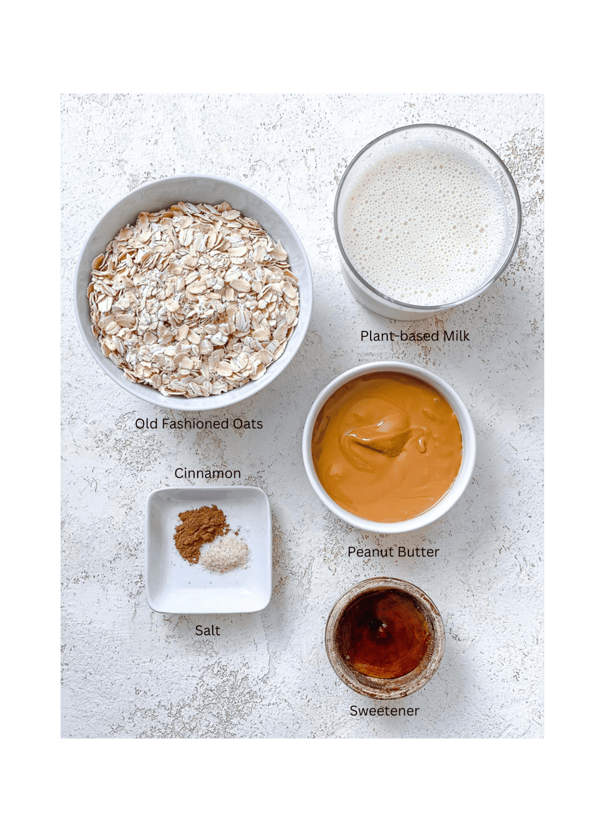 συστατικά για Easy Peanut Butter Oatmeal μετρημένα σε λευκή επιφάνεια