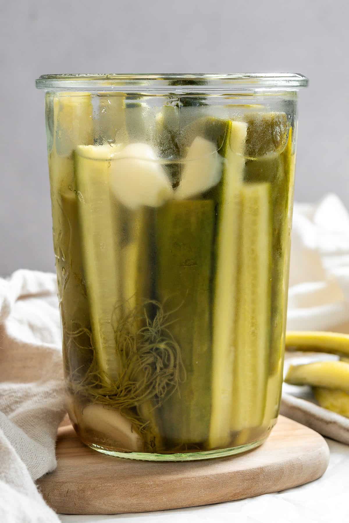 completed Quick Easy Refrigerator Pickles in a jar against a white background