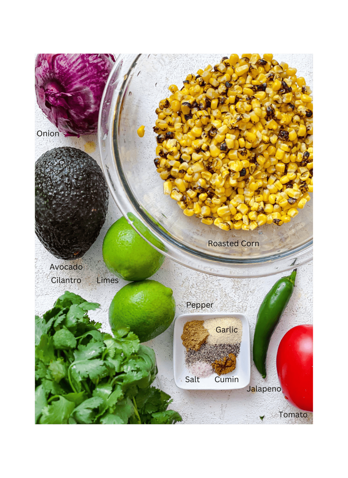 ingredients for Roasted Chili Corn Salsa  measured out against a white surface