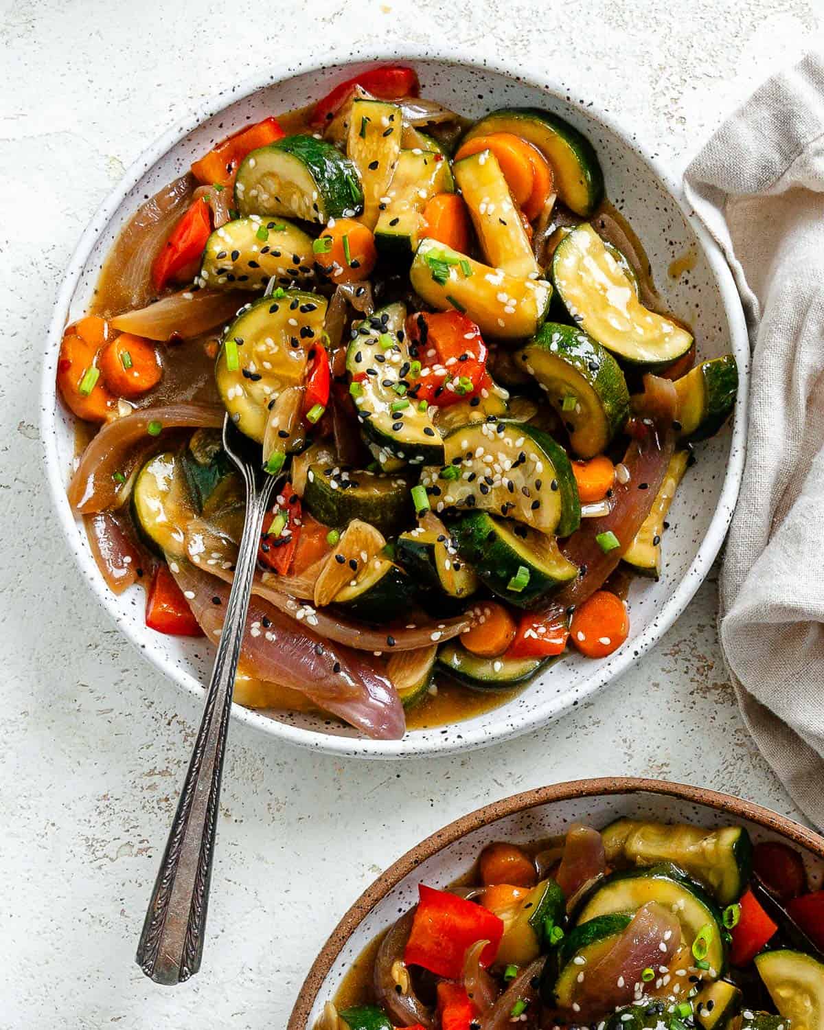 completed Easy Zucchini Stir Fry in two separate bowls