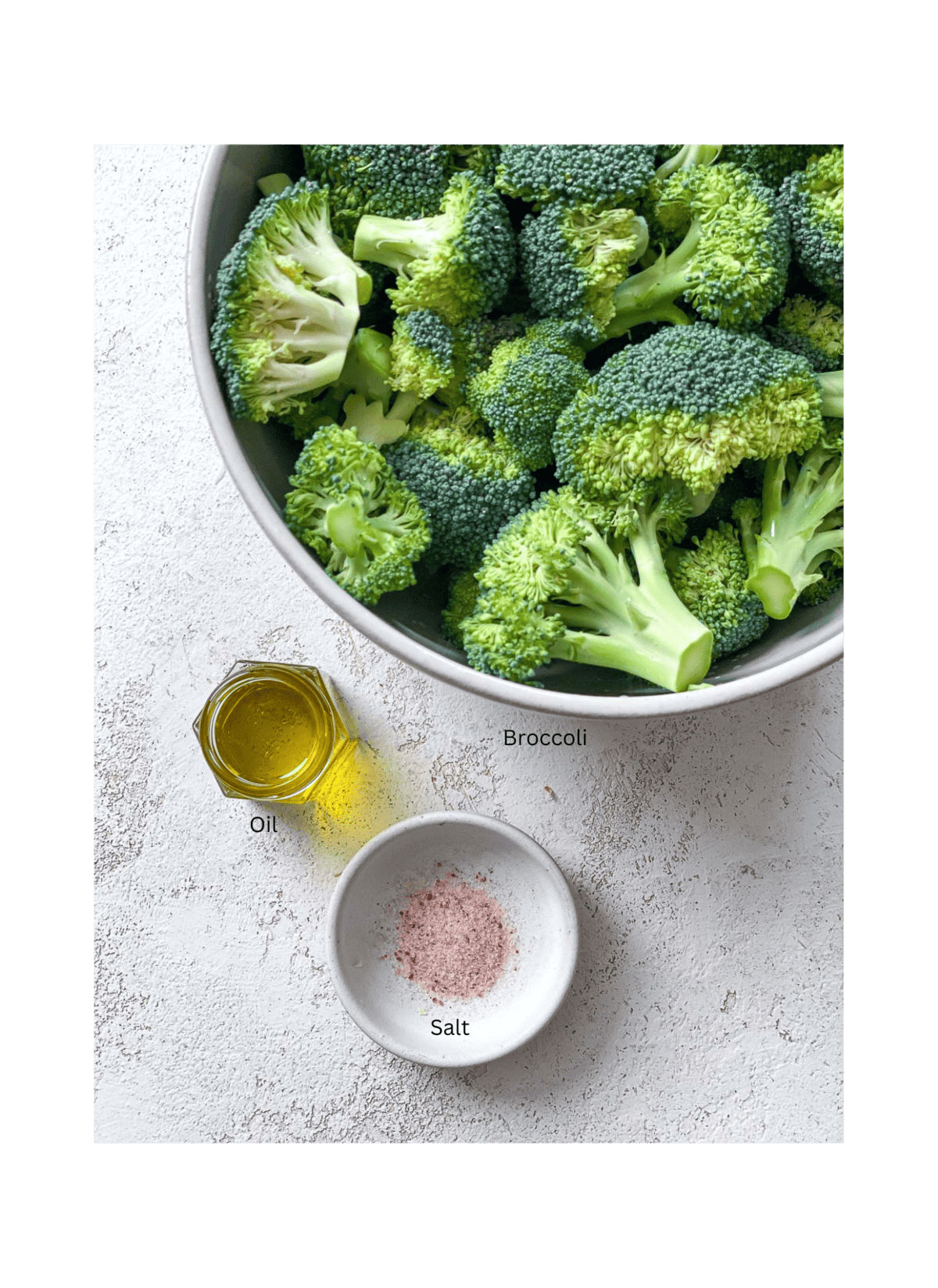 ingredients for Oven Charred Broccoli measured out on a white surface