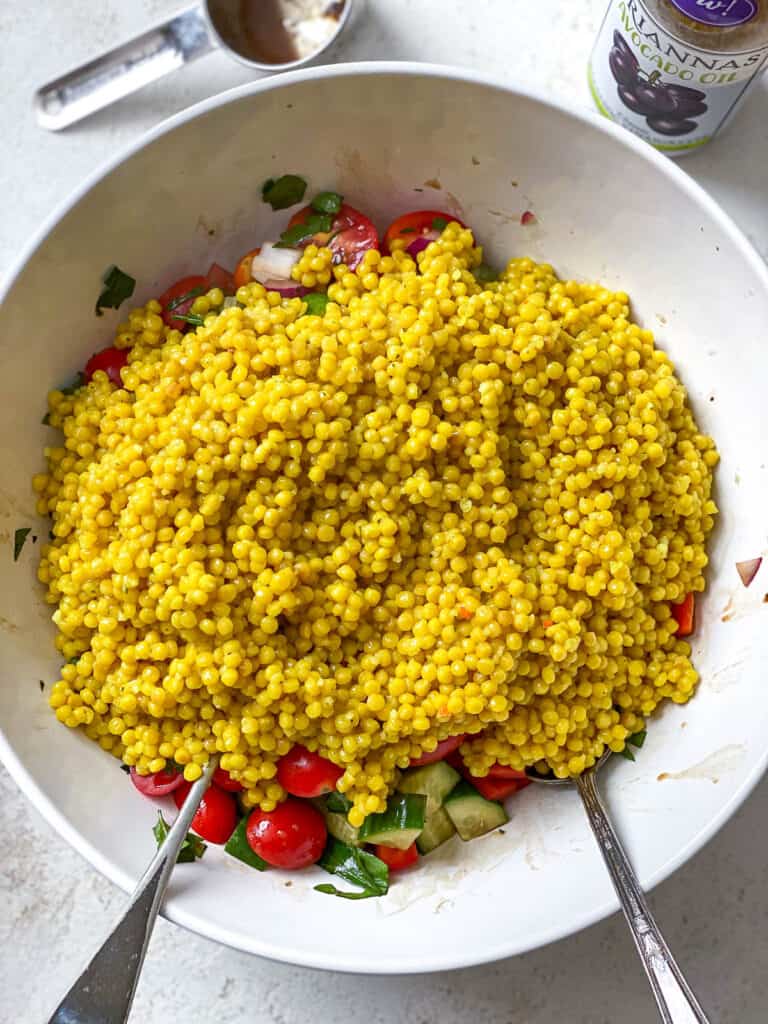 process s،t post adding couscous to bowl of veggies