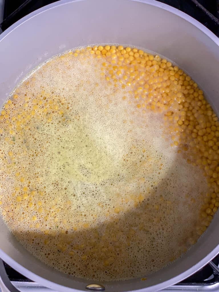 process shot of couscous cooking in a pot