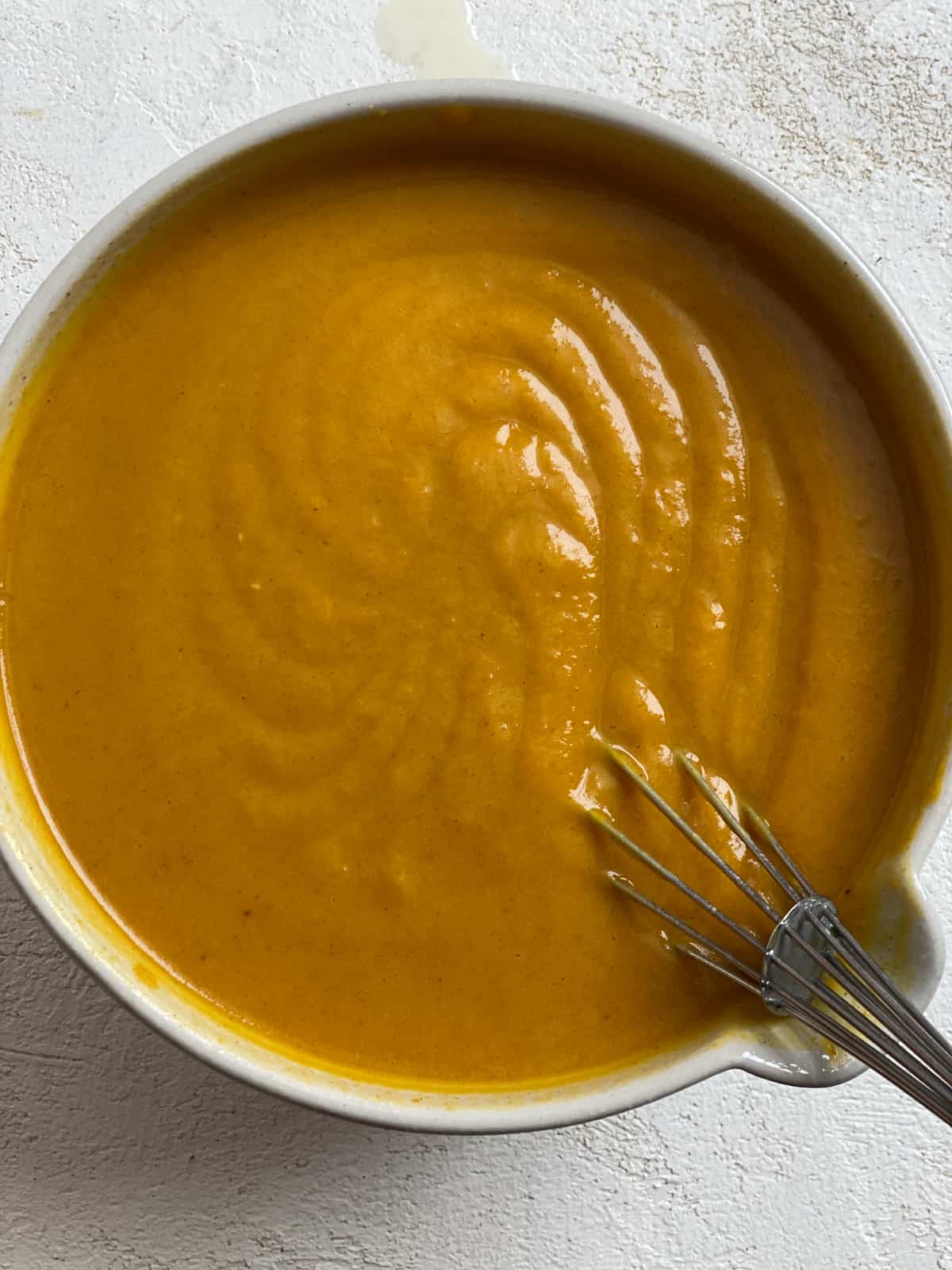 process s،t of mixing pumpkin pie mixture in bowl