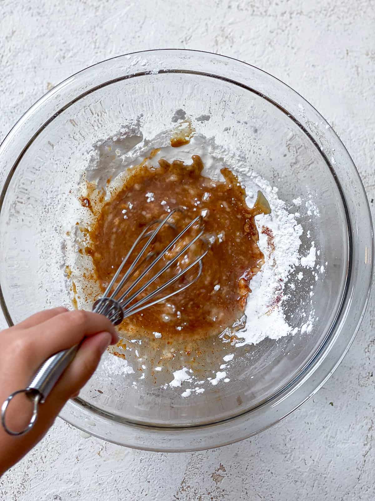 Whisking together soy sauce, cornstarch, and seasonings