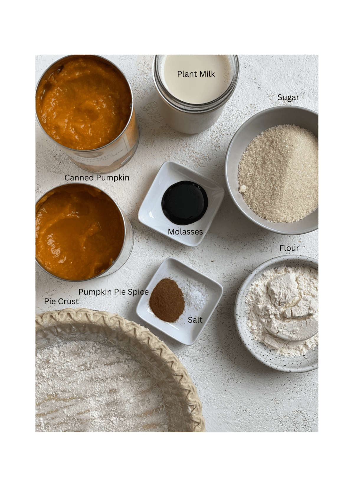 ingredients for Easy Vegan Pumpkin Pie measured out against a white surface