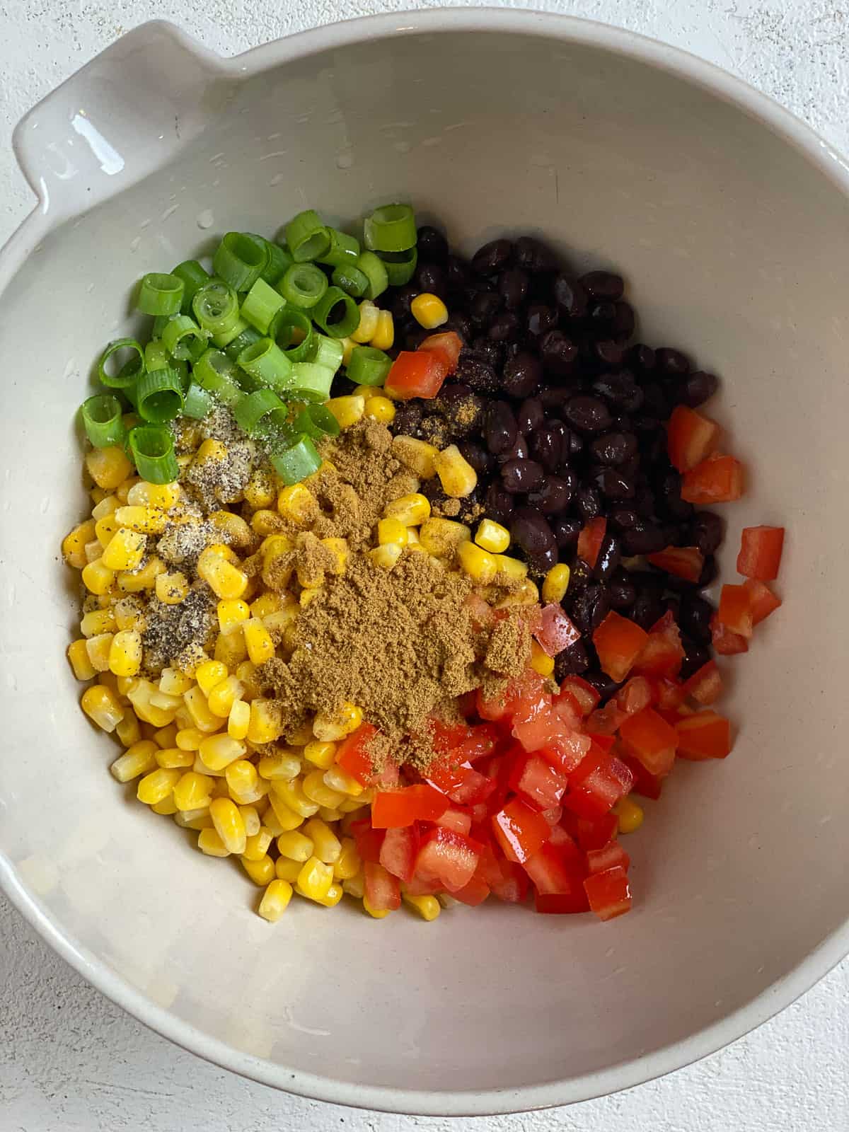 ingredients for Southwest Stuffed Sweet Potatoes added to bowl