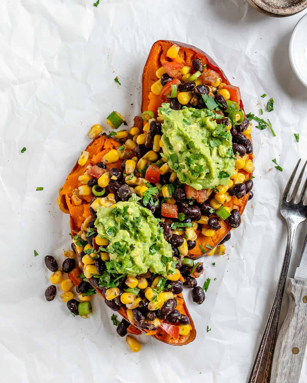 completed Southwest Stuffed Sweet Potatoes against a white surface