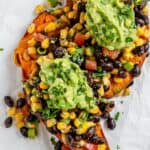 completed Southwest Stuffed Sweet Potatoes against a white surface