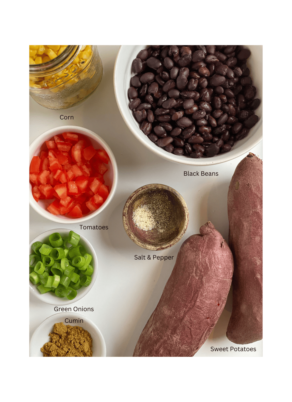 ingredients for Southwest Stuffed Sweet Potatoes measured out against a white surface
